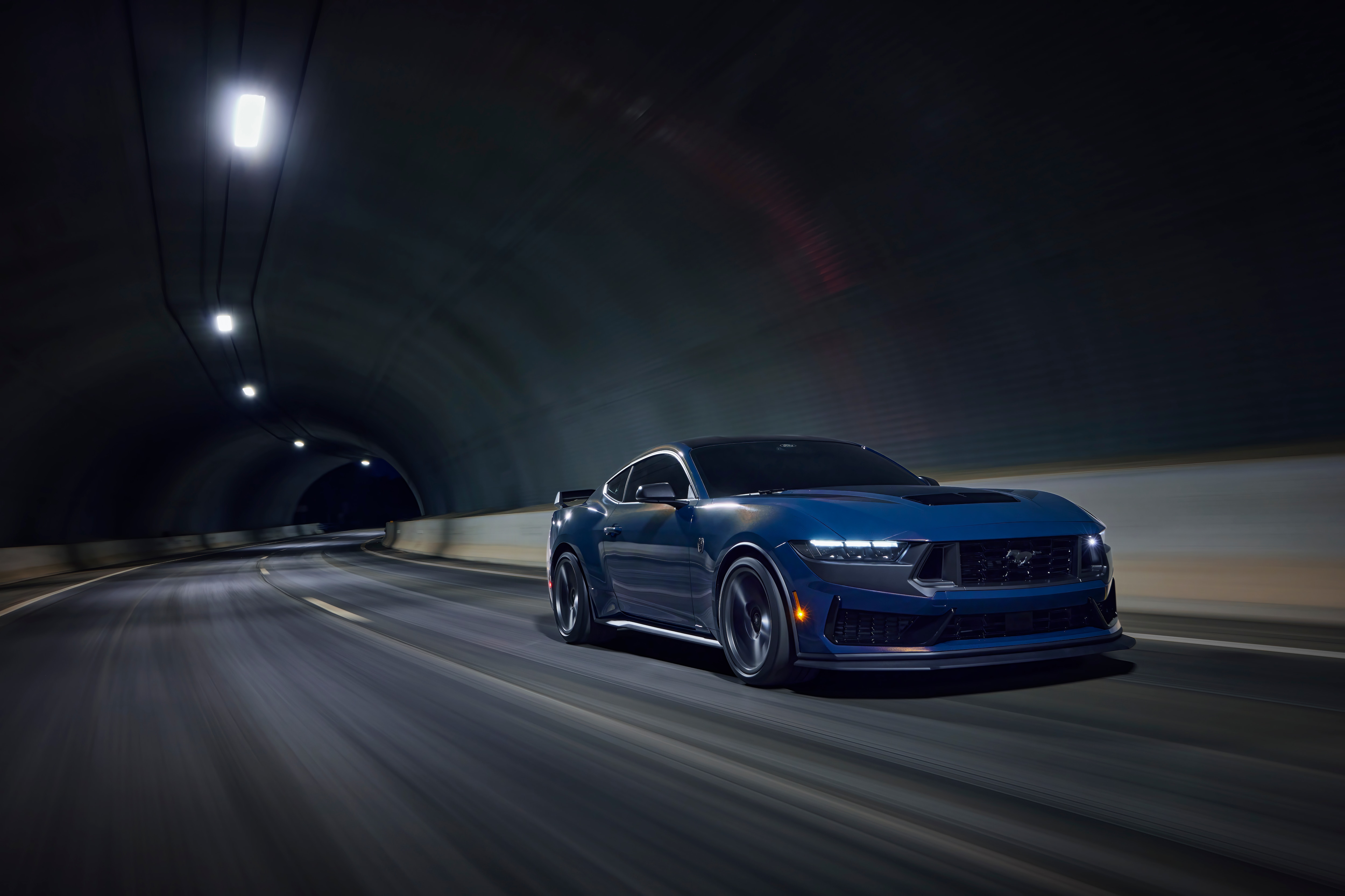 With sinister looks and a specially modified 5.0-liter V8 – the most powerful 5.0-liter V8 ever, projecting 500 horsepower – Dark Horse expands the Mustang lineup and sets a new benchmark for American street and track performance that could only come in a Mustang. Pre-production vehicles shown. Closed course. Professional driver.